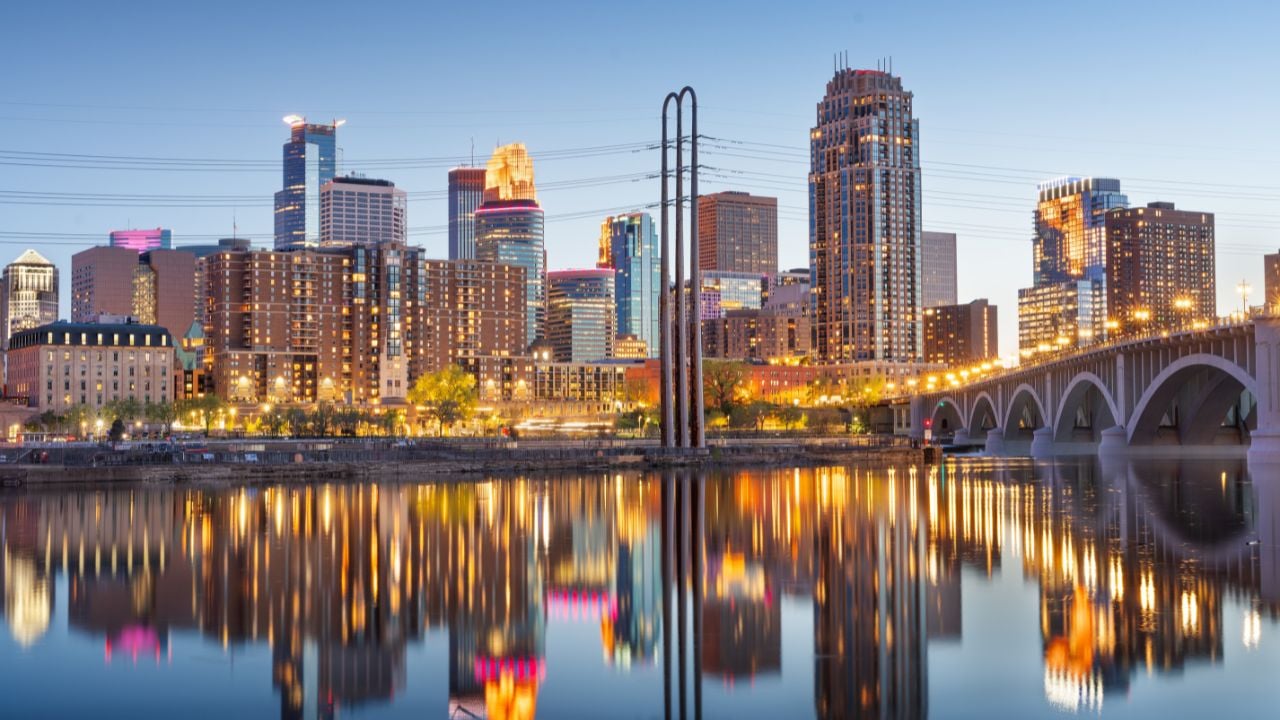 Minneapolis, Minnesota, USA downtown city skyline on the Mississippi at dusk.