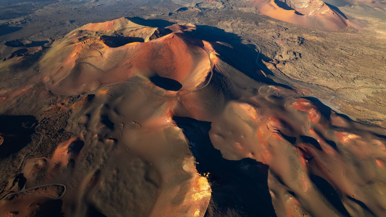 Amazing panoramic landscape of volcano craters in Timanfaya national park. Popular touristic attraction in Lanzarote island, Canary islands, Spain