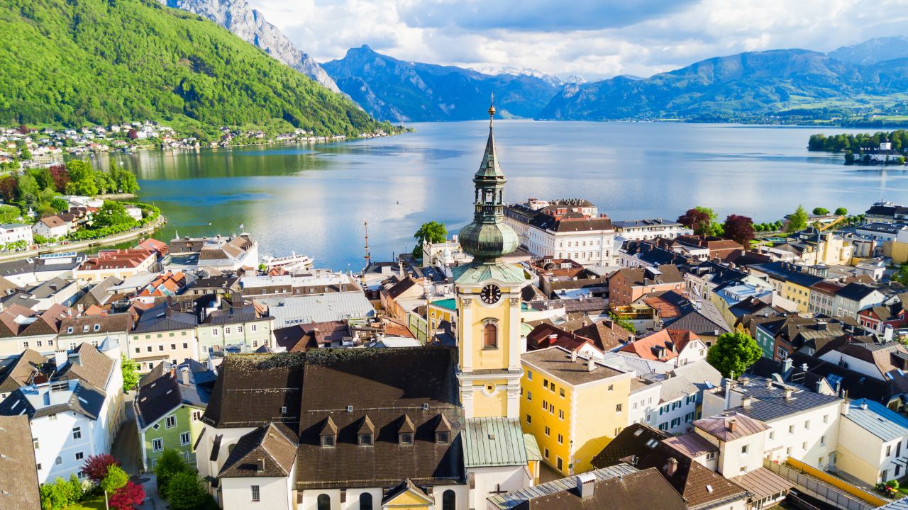 Pfarrkirche catholic parish church in Gmunden city centre and Traunsee lake aerial panoramic view, Austria. Gmunden is a town in Salzkammergut region in Upper Austria.