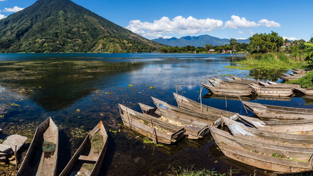 Cayucos on Lake Atitlán with San Pedro volcano in Guatemala.