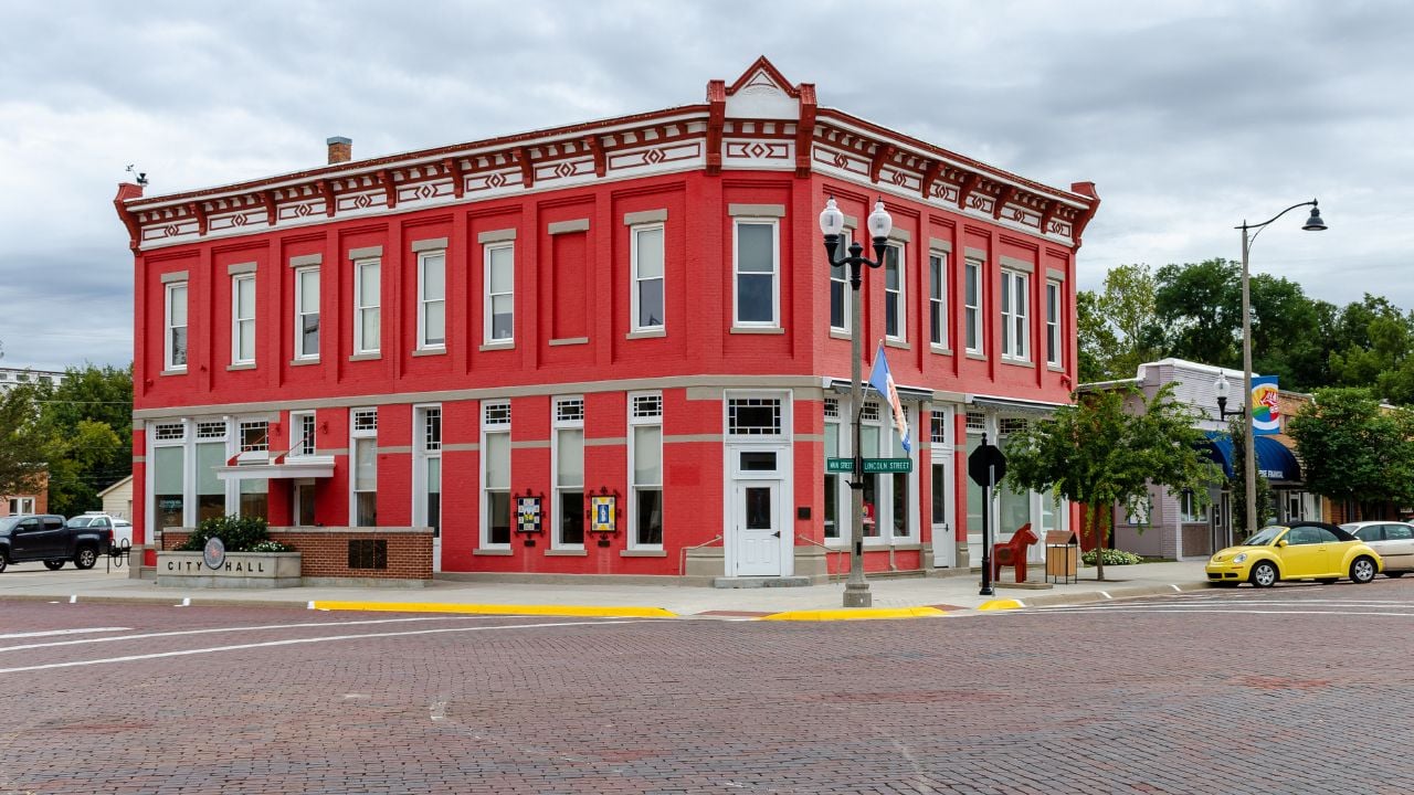 October, 2019, Lindsborg, Kansas, USA - The original Farmers State Bank building in Lindsborg, Kansas, is now home to City Hall and sports a bright red coat of paint.