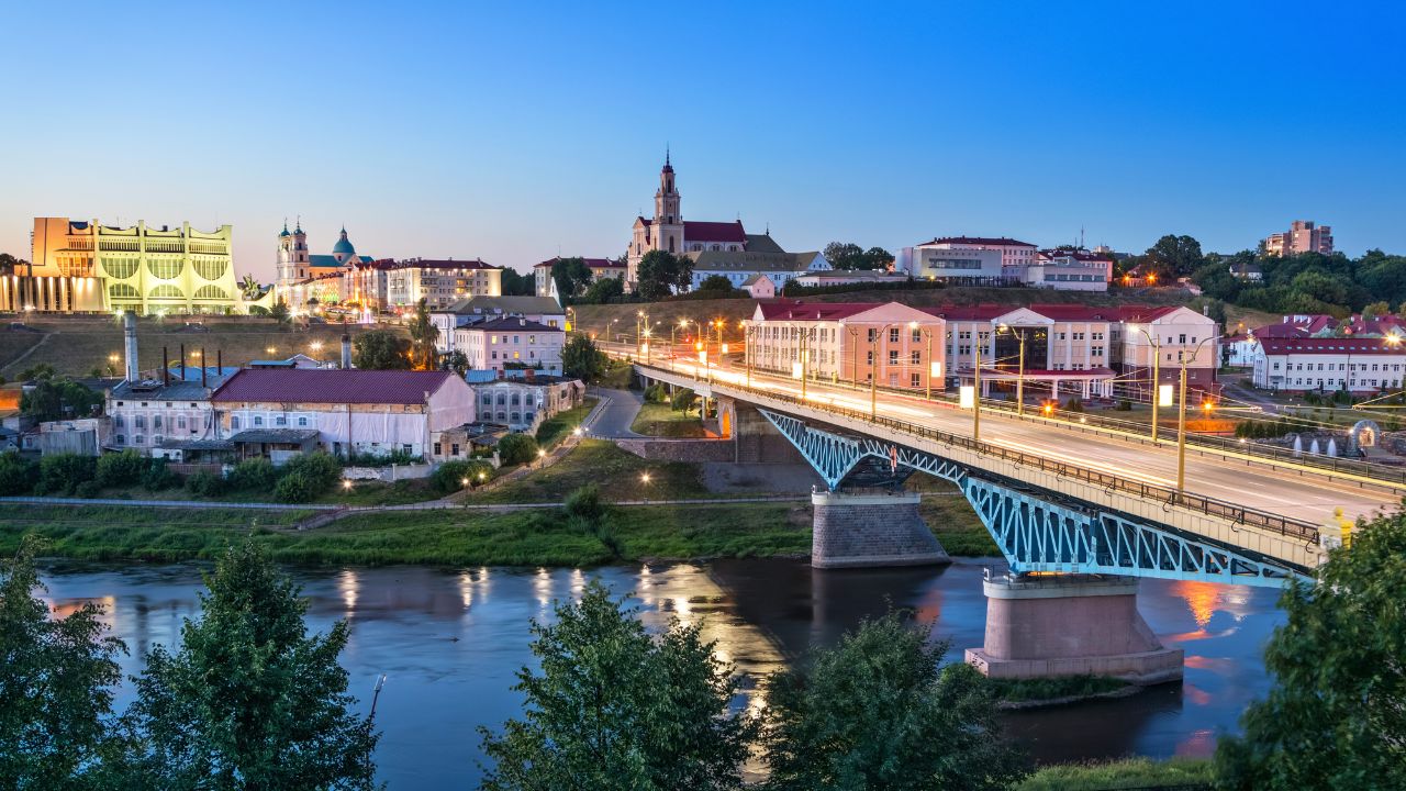 Cityscape of Grodno at dusk with bridge over Neman river, Belarus