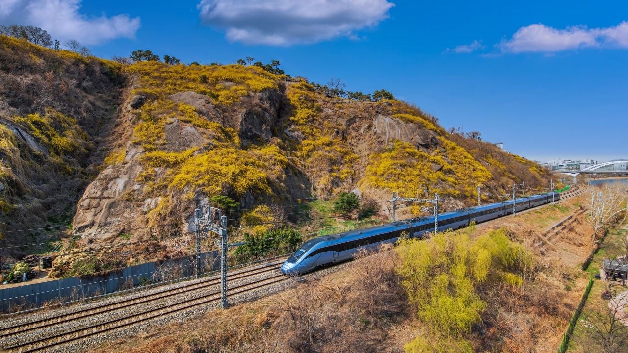 View of Eunbongsan Mountain in spring and the traffic route of the express train on a clear day, Seoul, South Korea.