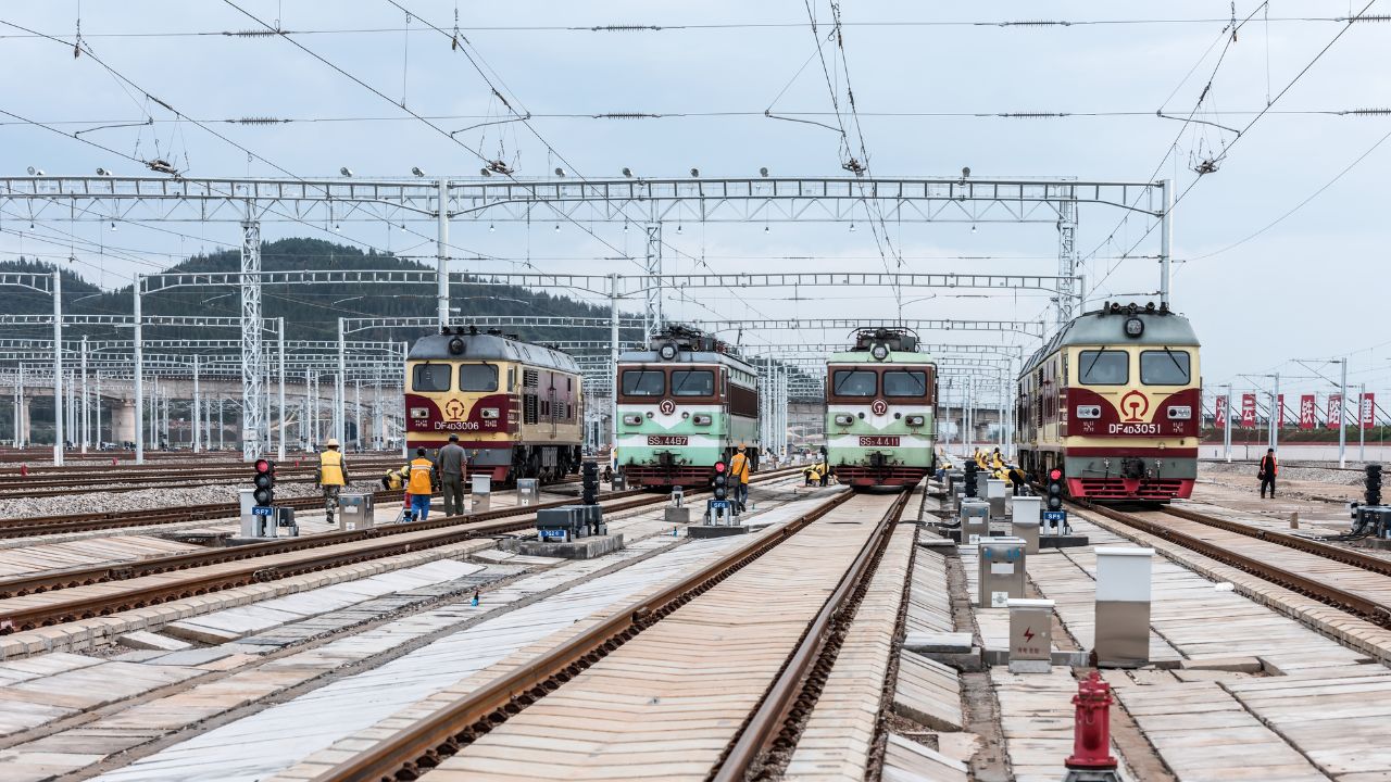 Railway workers maintain high-speed railway tracks at a high-speed railway station in kunming, southwest China's yunnan province, sept 28, 2018
