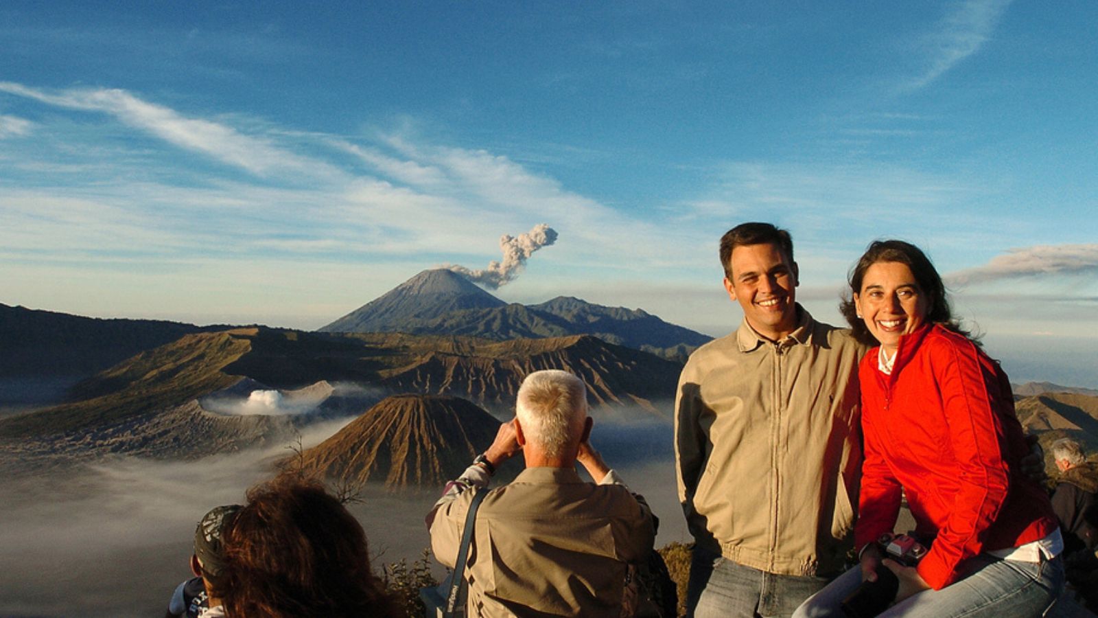 Travelers pose with the background of the beauty of Mount Bromo, East Java, Indonesia