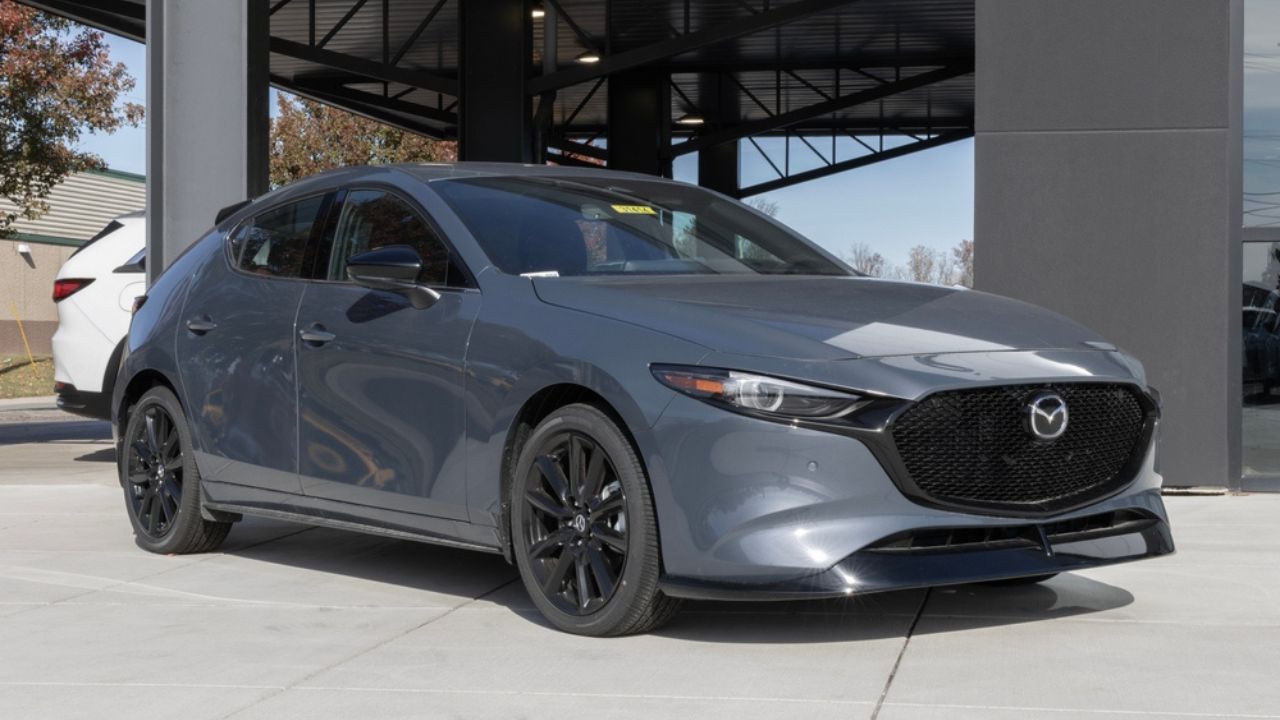 Fort Wayne - November 13, 2025 Mazda3 Premium Plus AWD Hatchback display. Mazda offers the Mazda3 with a 2.5L Turbocharged 4-Cylinder engine.