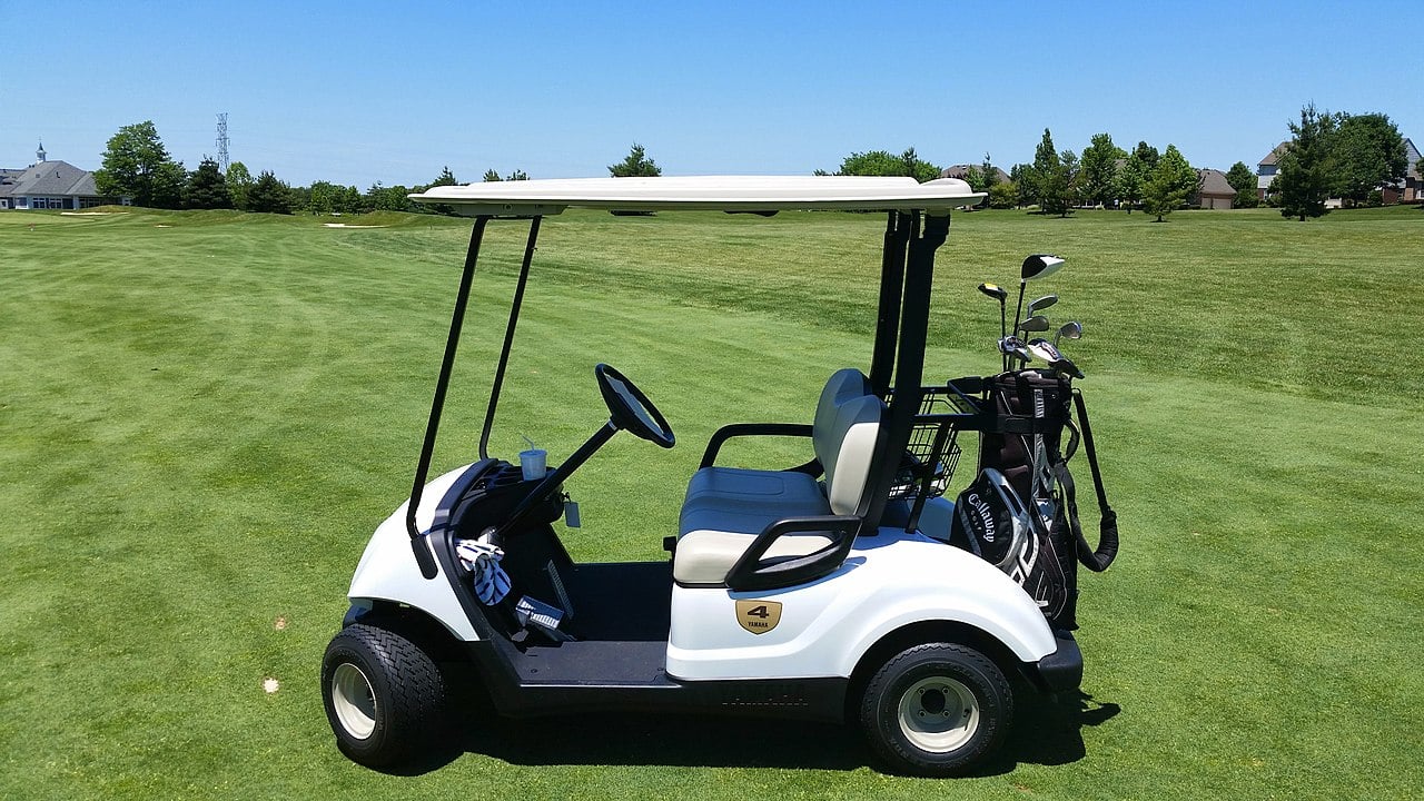 Golf cart on golf course.