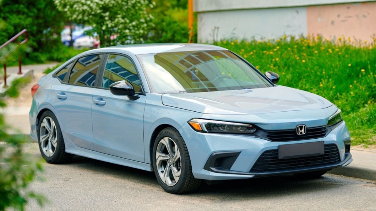 Minsk, Belarus. Honda Civic 11th generation parked in residential area on parking lot. Honda Civic Sedan, front view, body exterior design. Sonic Grey Pearl Color Code - Honda Civic 11