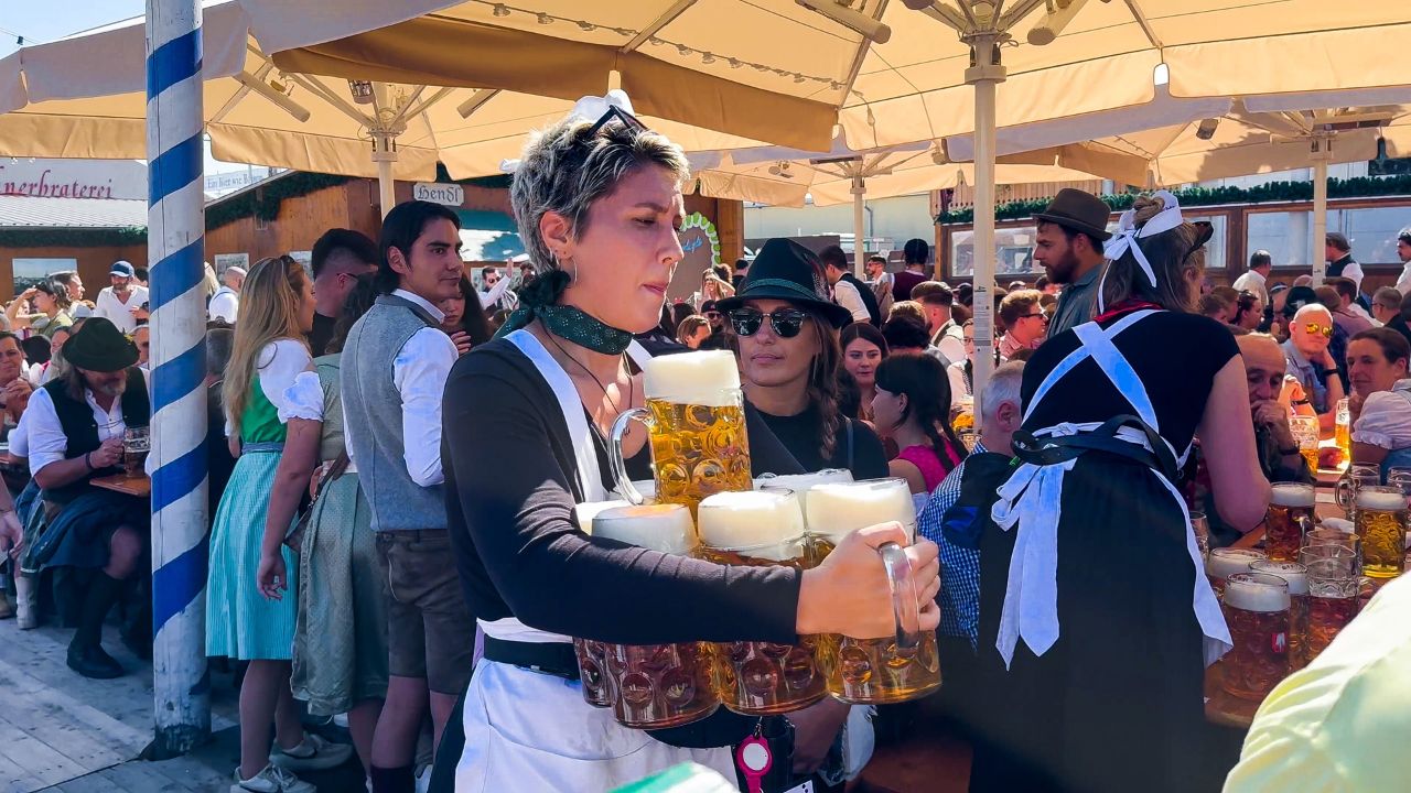 Waitresses carrying beer mugs at Oktoberfest, Munich, Germany September 21, 2024.