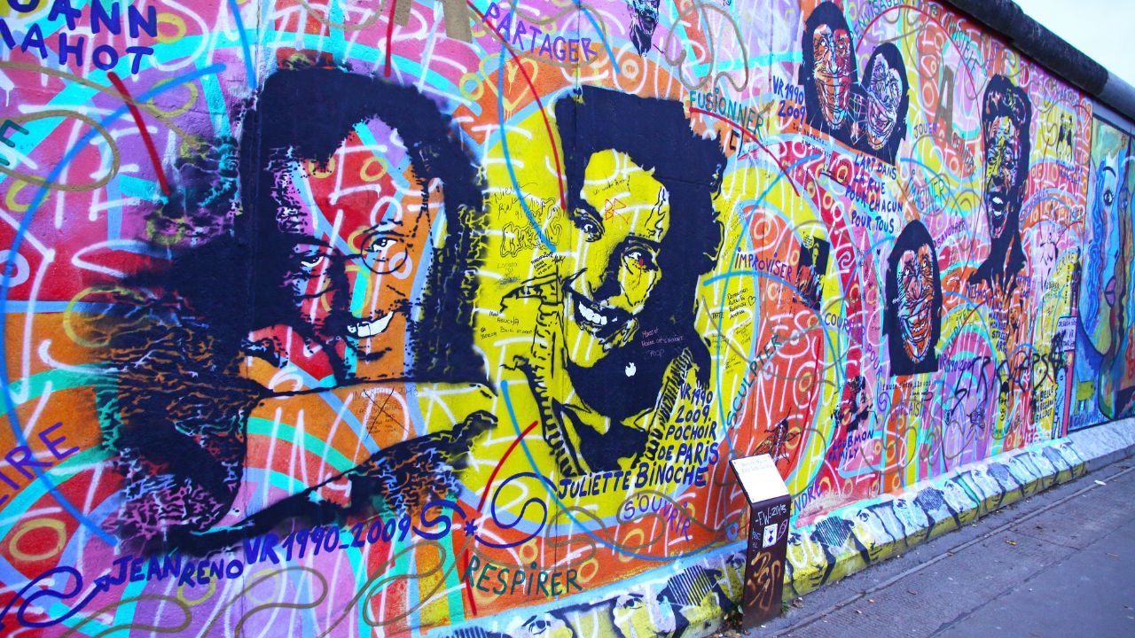 BERLIN - NOVEMBER 10: Fragment of East Side Gallery on November 10,2013 in Berlin. It's a 1.3 km long part of original Berlin Wall which collapsed in 1989 and now is the largest world graffiti gallery
