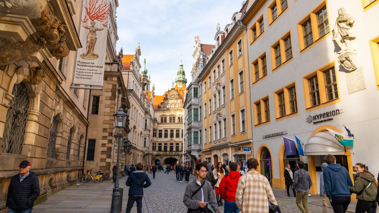 Dresden, Germany - October 19, 2024: Tourists walking on street of historic centre of Dresden, Germany.