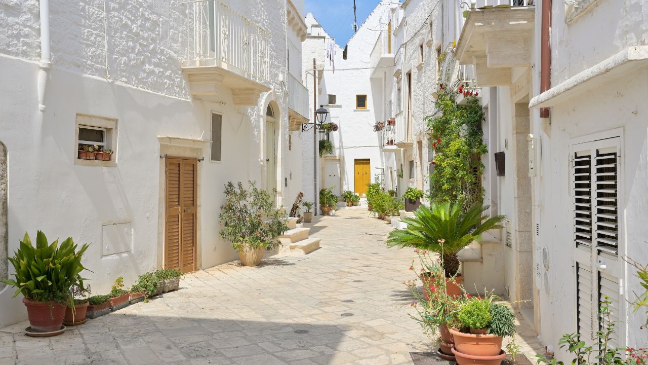 Whitewashed alley in the old town of Locorotondo, Puglia, Italy