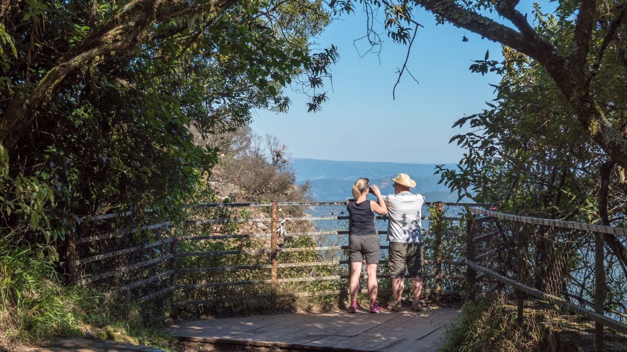 PANORAMA ROUTE, SOUTH AFRICA - MAY 20, 2019: Unidentified tourists at a viewpoint at Gods Window on road R534 near Graskop