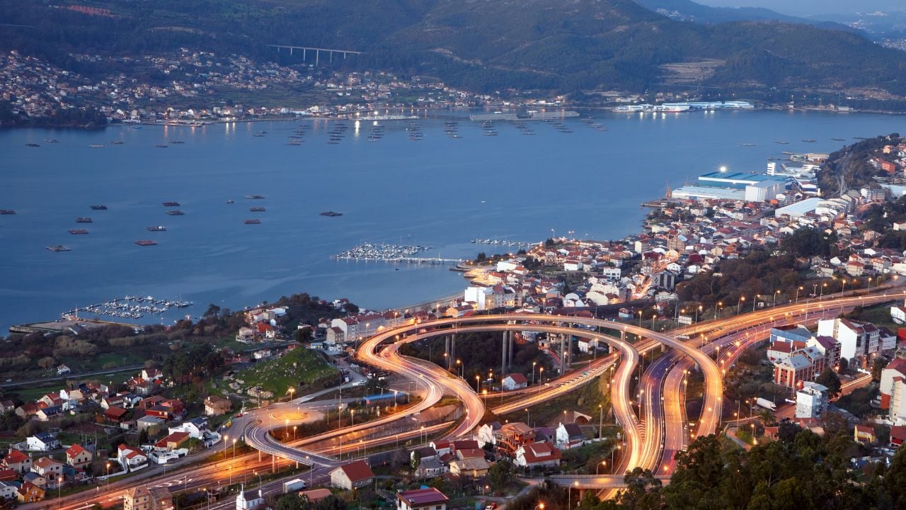 An aerial view of the city of Vigo on a beautiful evening with car lights on the streets in Galicia, Spain
