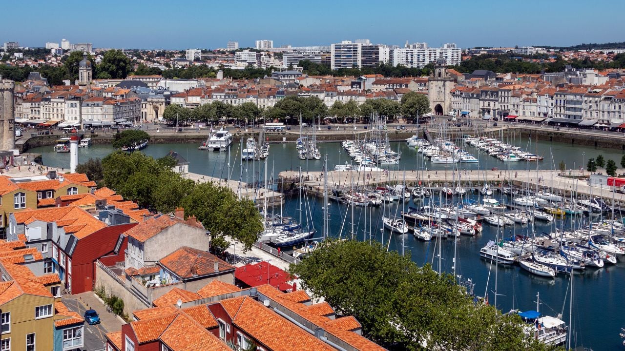 Panoramic high level view of the port of La Rochelle on the coast of the Poitou-Charentes region of France. The tower on the left is the Tour de la Chaine and dates from the 11th century.