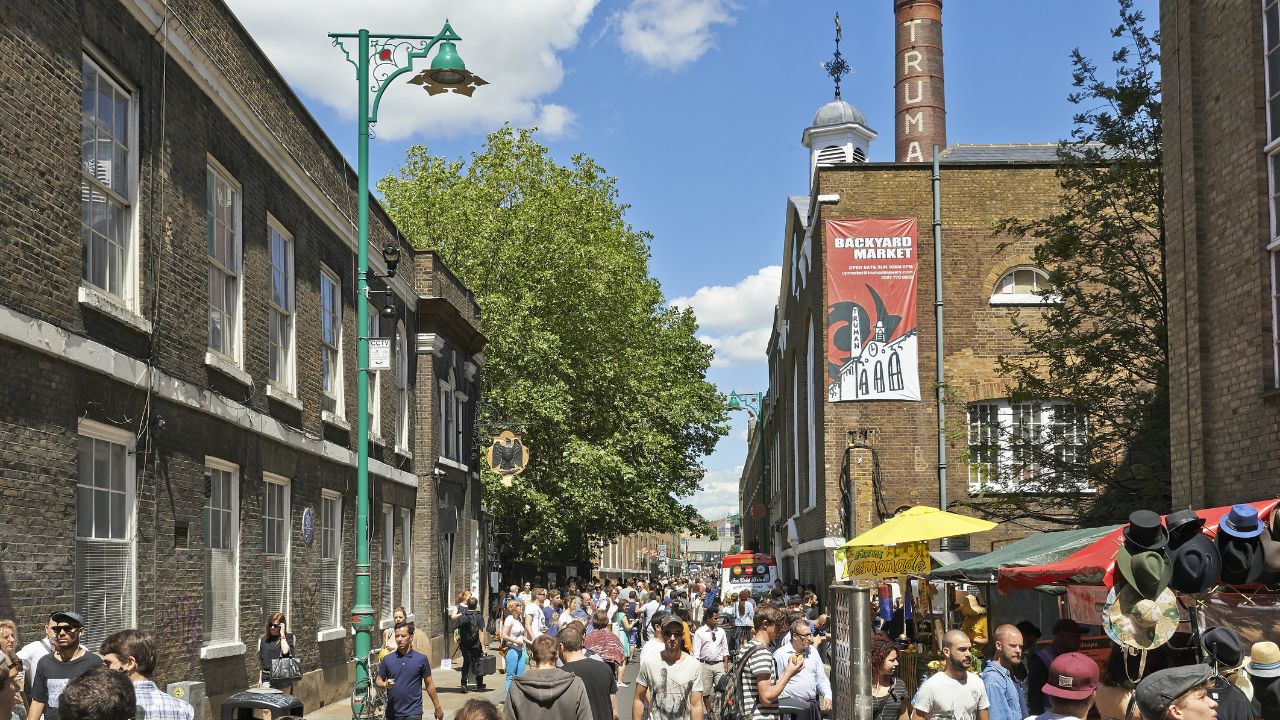 LONDON - JUNE 08, 2014: Tourists in Brick Lane on a busy sunny Sunday on June 08, 2014 in London.