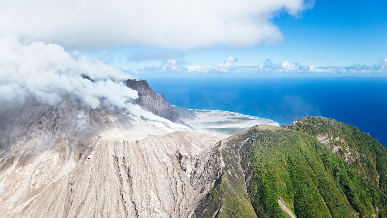 The active Soufriere Hills Volcano in Montserrat seen from helicopter. The dead landscape is frequently covered by new pyroclastic flows.