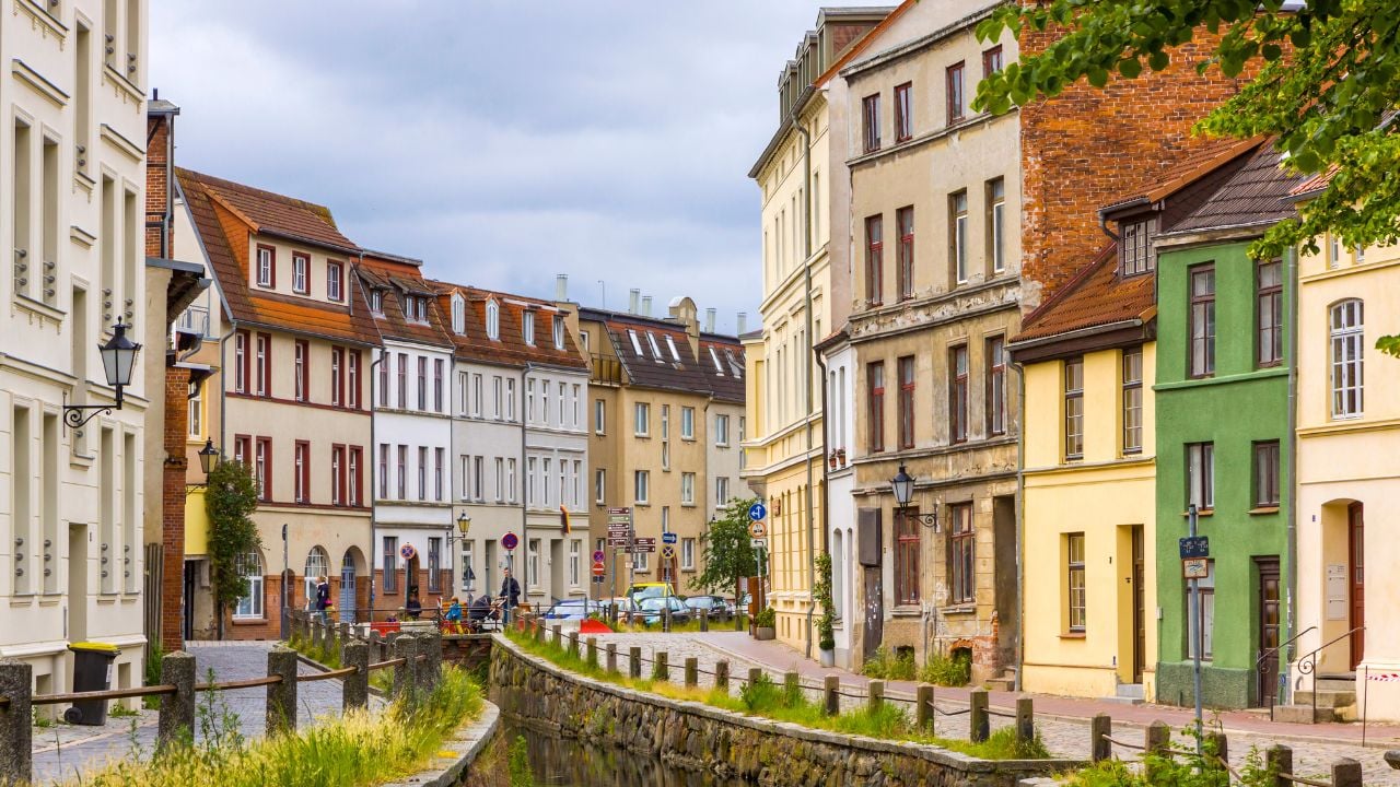 On the streets of Wismar old town. Colorful houses along the canal of Grube river, Wismar city, Mecklenburg-Vorpommern state, Germany