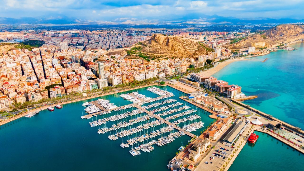 Alicante city port with boats and yachts aerial panoramic view. Alicante is a city in the Valencia region, Spain.