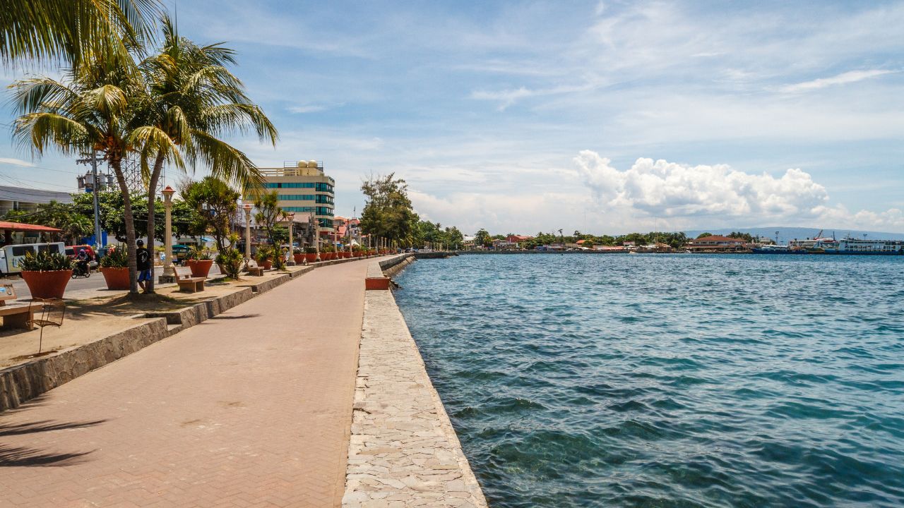 The promenade along Rizal Boulevard with trees and sea view, City of Dumaguete, Negros Oriental, Philippines