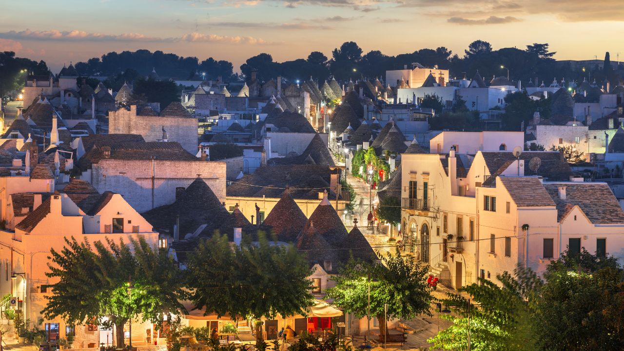 Alberobello, Italy with Trulli houses at dusk.