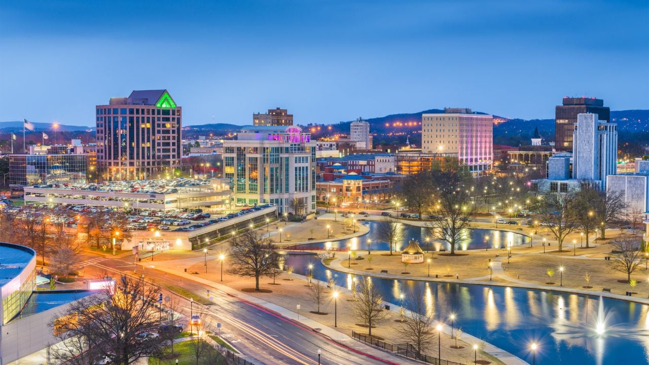 Toledo, Ohio, USA downtown skyline on the Maumee River at twilight.