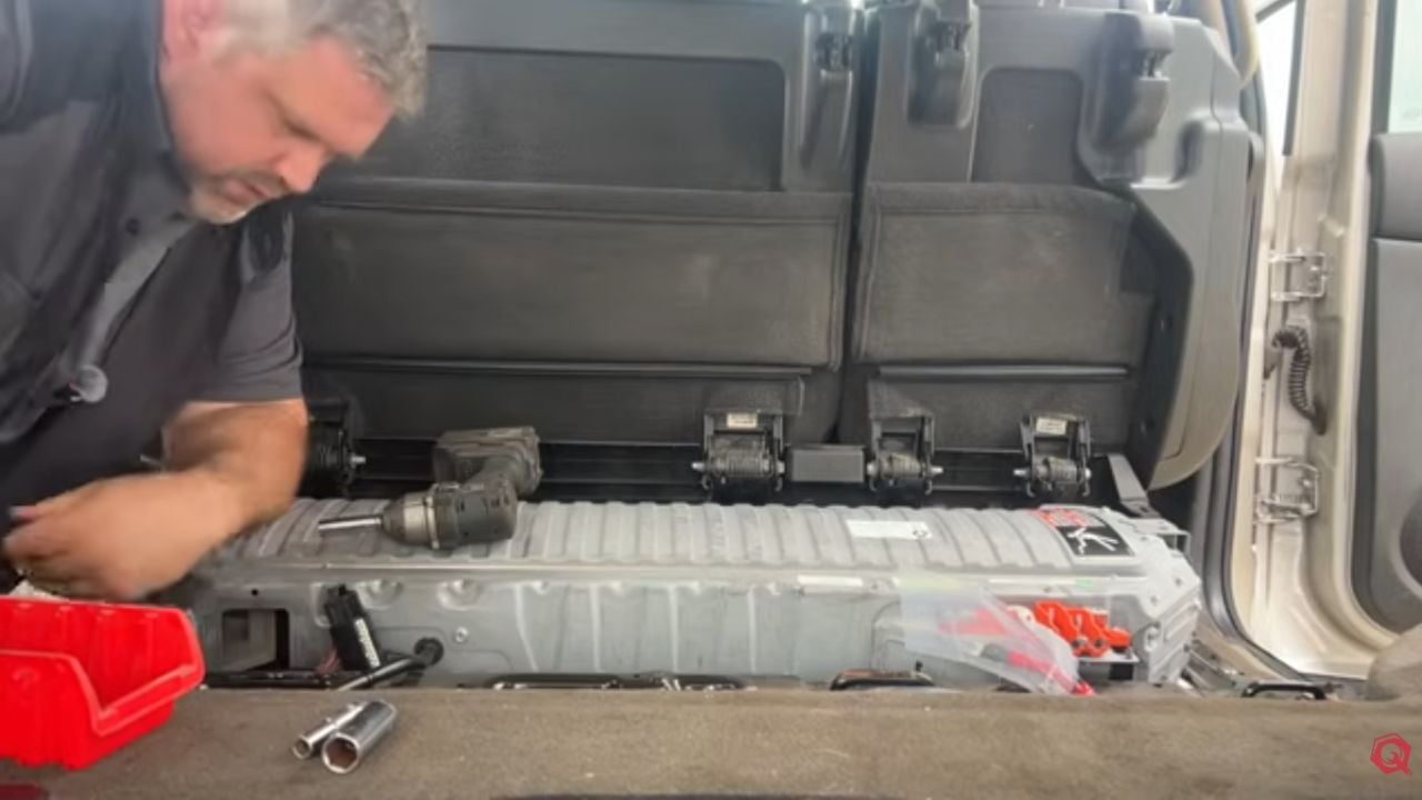 Jared from Questionable Garage and his broken Chevrolet Tahoe Hybrid.