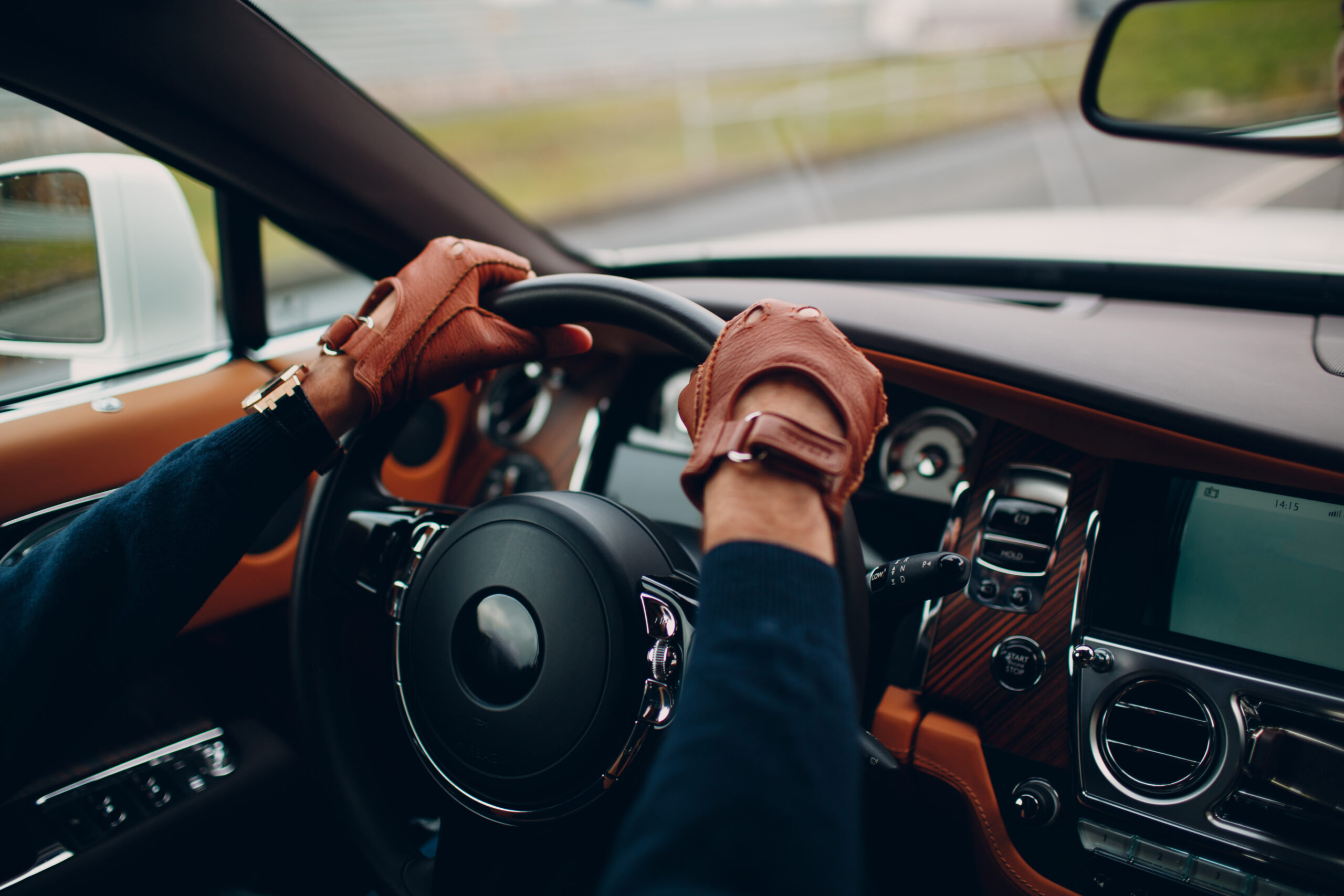 man driving with gloves