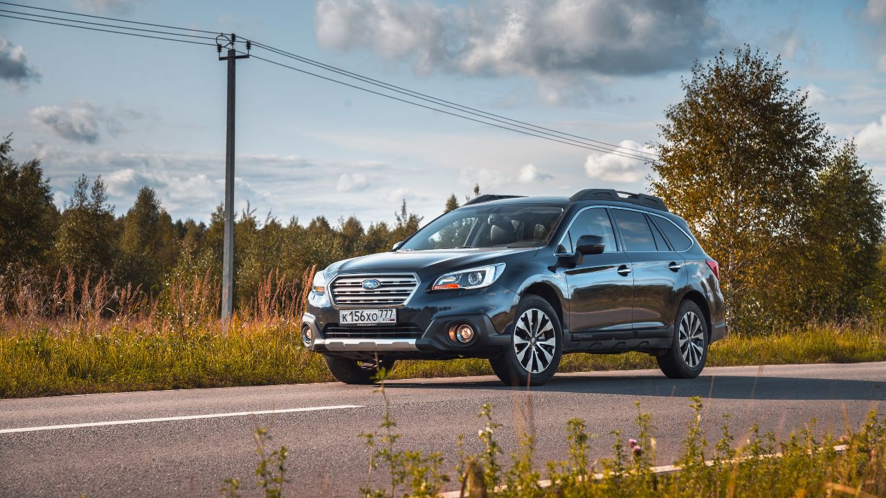 Dmitrov, Russia - Subaru Outback Suv on the countryside road