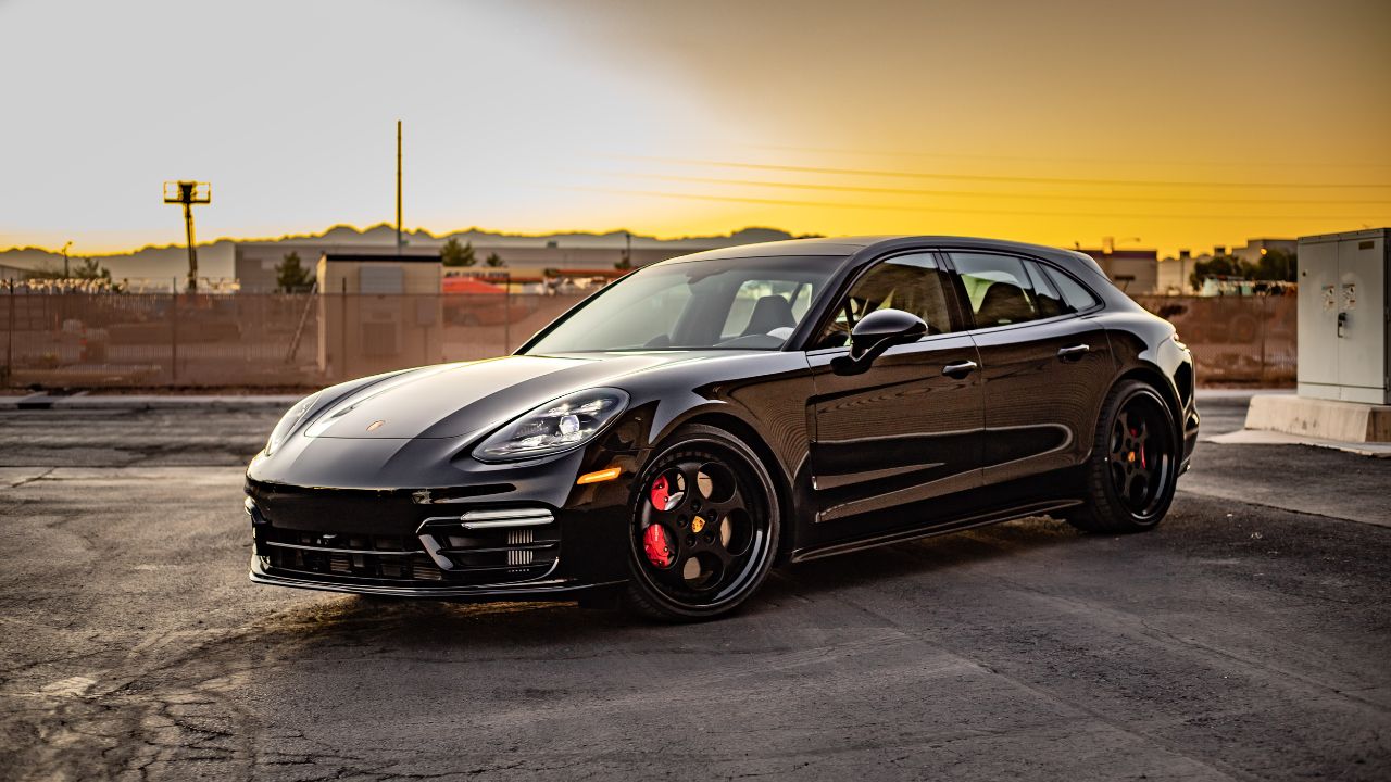 Las Vegas, Nevada USA - Black 2020 Porsche Panamera GTS parked on street during sunset.