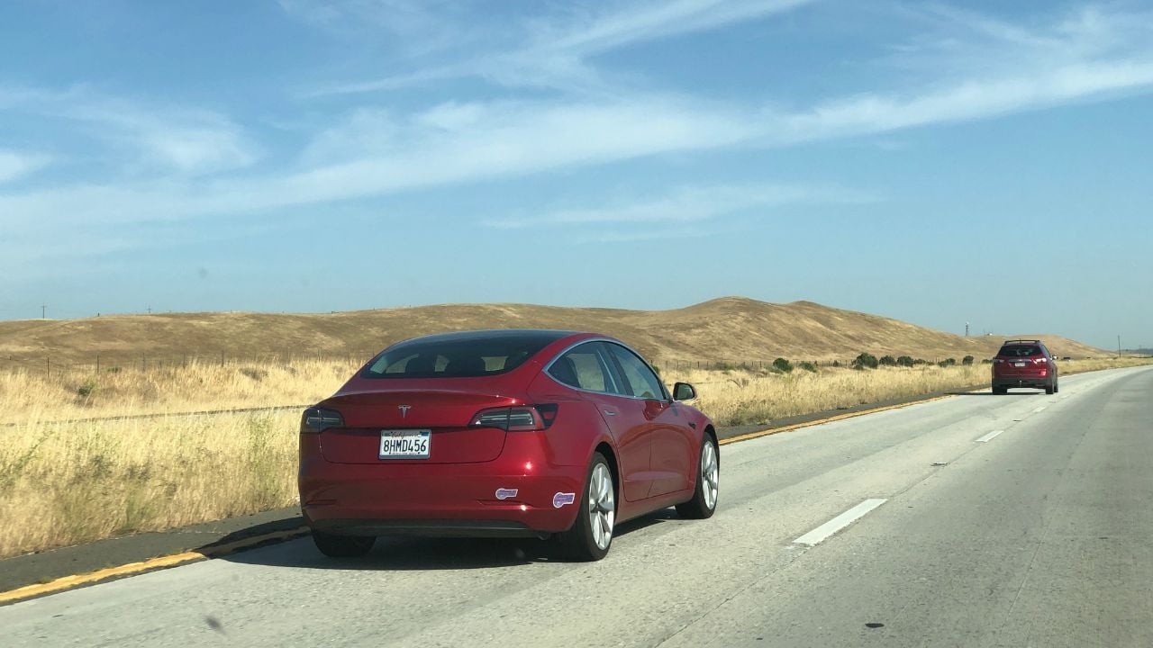SELINAS, CA, USA - Red Tesla Model S on the highway