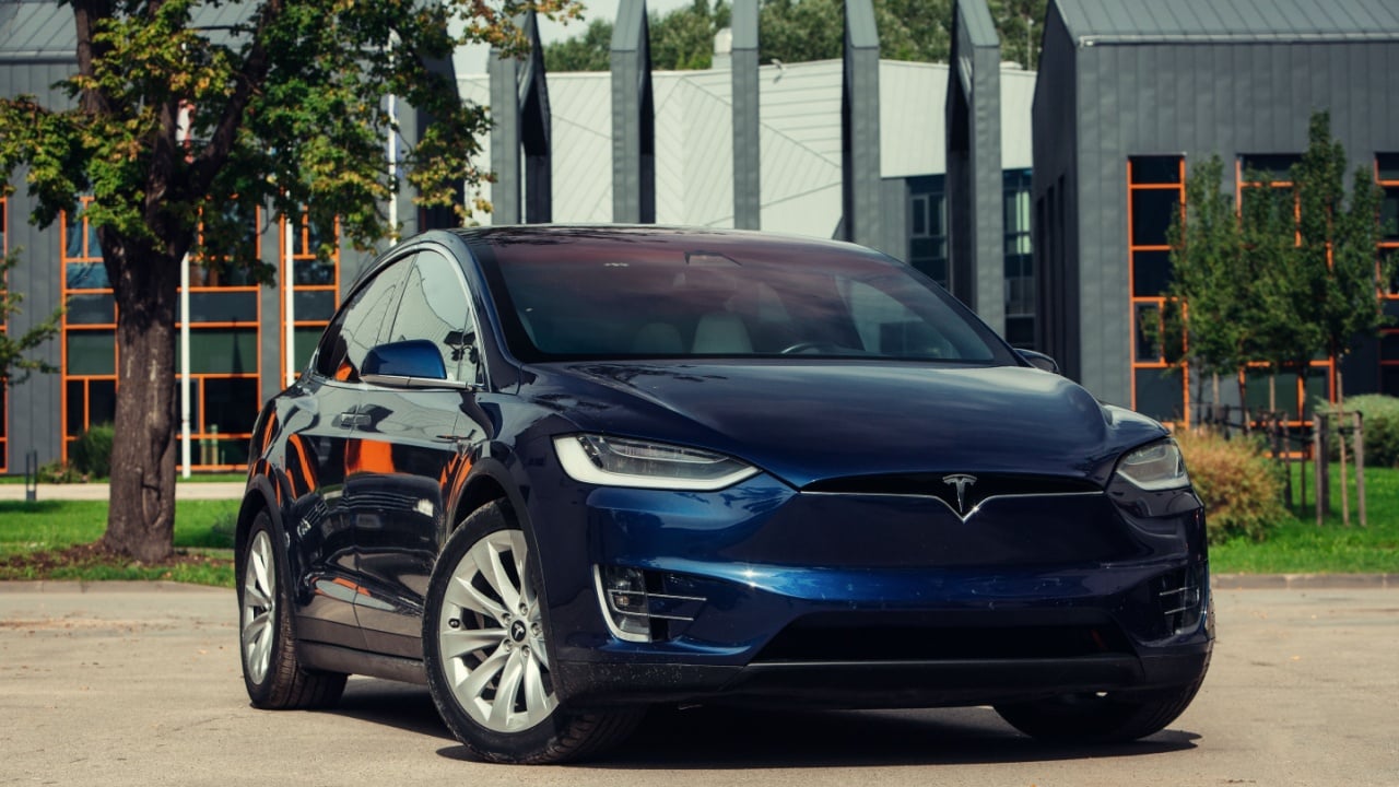 Riga, LV - AUG 27, 2023: Tesla Model X at the parking of modern business center