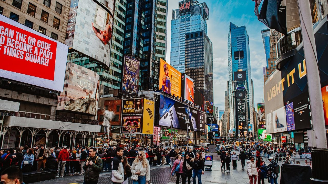 New York, USA, 28 May 2025: Crowds enjoying Times Square in New York. Visitors wander through Times Square, taking in the vibrant lights and atmosphere of this iconic location in New York.