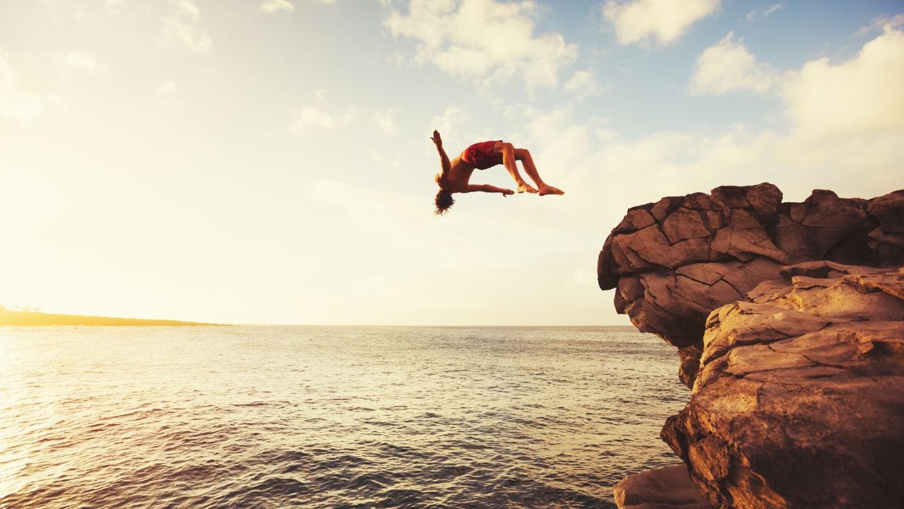 Cliff Jumping into the Ocean at Sunset, Summer Fun Lifestyle
