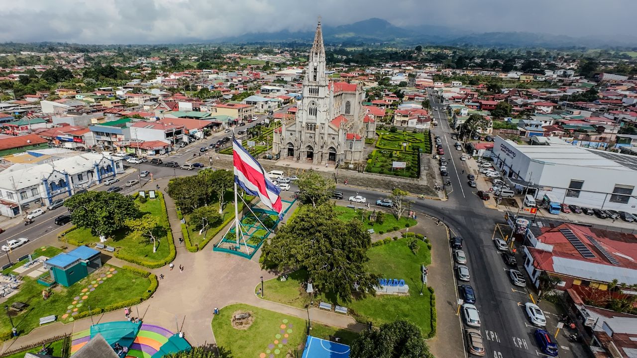San José, Costa Rica: aerial view of a large Costa Rican flag display in a city park.