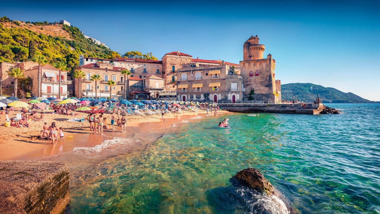 Hot summer day on Santa Maria di Castellabate puclic beach, Italy, Europe. Wonderful outdoor scene of italian resort. Vacation concept background.