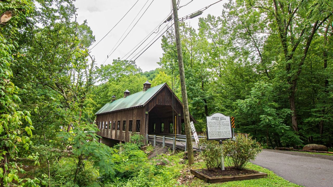 Pittman Center, Tennessee, USA-July 20, 2024: Emerts Cove Covered Bridge, built in 2000, spans the Middle Prong of the Little Pigeon River -named for Frederick Emert who was the area's first settler.