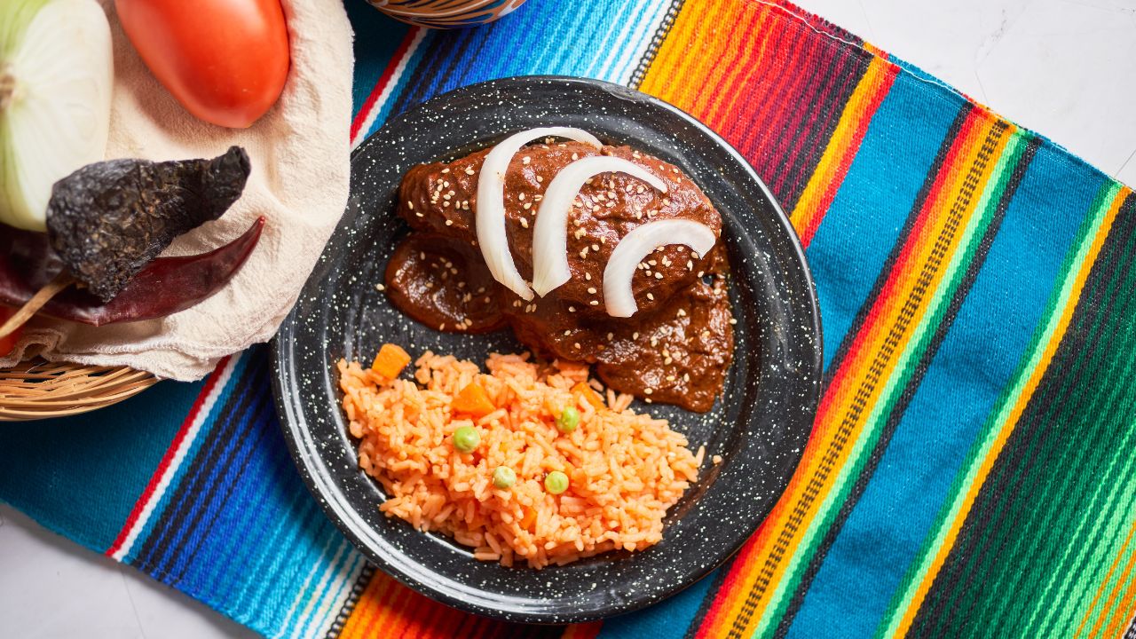 Traditional mexican mole sauce with chicken, steamed rice