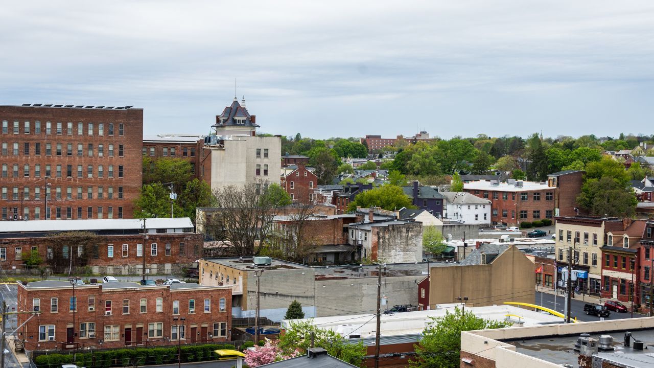 Aerial of historic downtown Lancaster, Pennsylvania with blooming trees