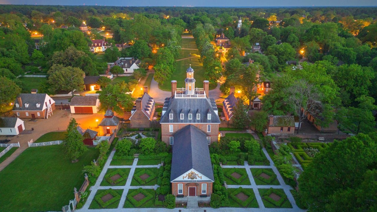 WILLIAMSBURG, VIRGINIA - MAY 8, 2023: Historic Williamsburg Village at the Governor's Palace at twilight.