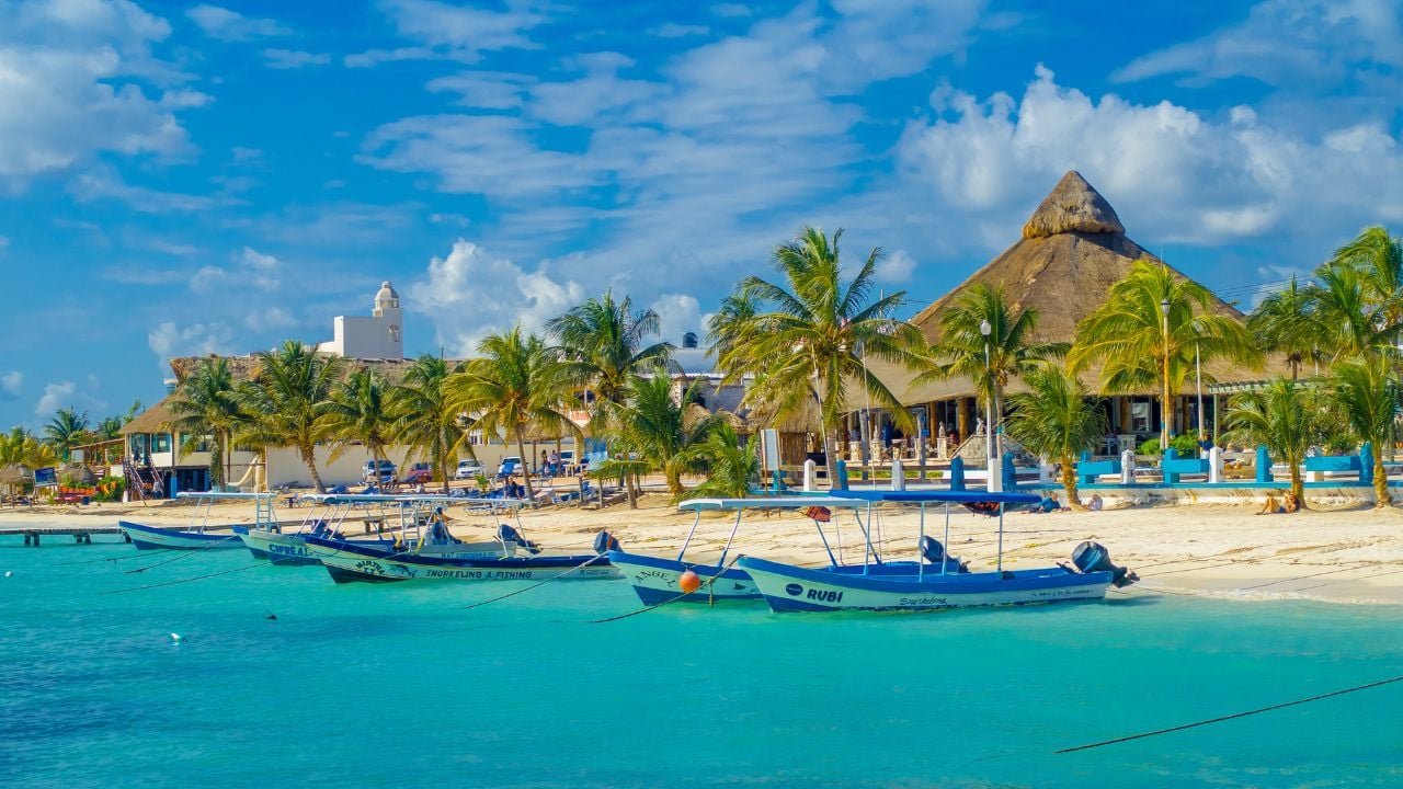 Puerto Morelos, Mexico - January 10, 2018: Outdoor view of many boats in a row in the water in Puerto Morelos beach Mexico