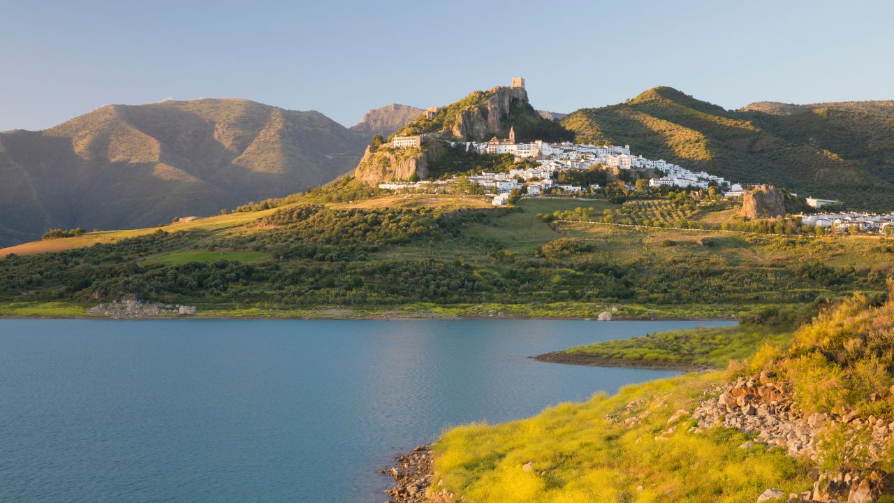 Moorish castle above white village and reservoir, Zahara de la Sierra, Sierra de Grazalema Natural Park, Andalucia, Spain, Europe