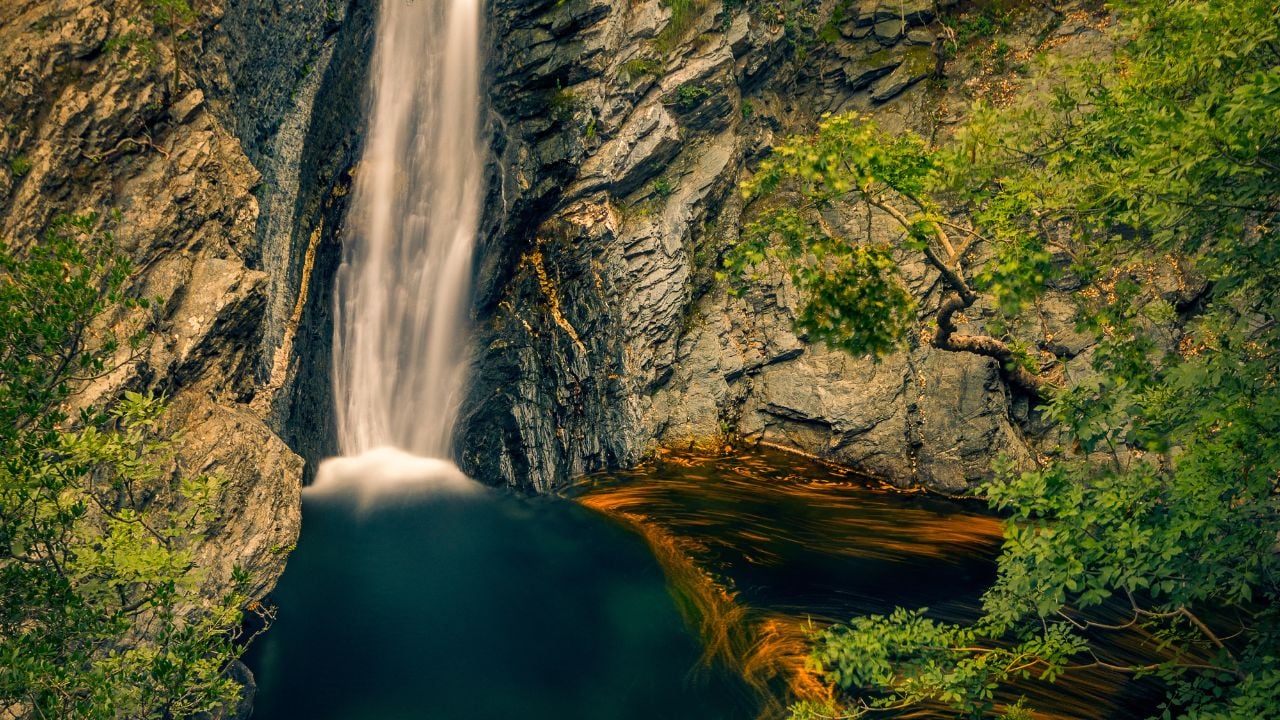 Incredible high waterfall falling through the cliffs on Fonias river on Samothrace island in Greece in abeautiful natural landscape