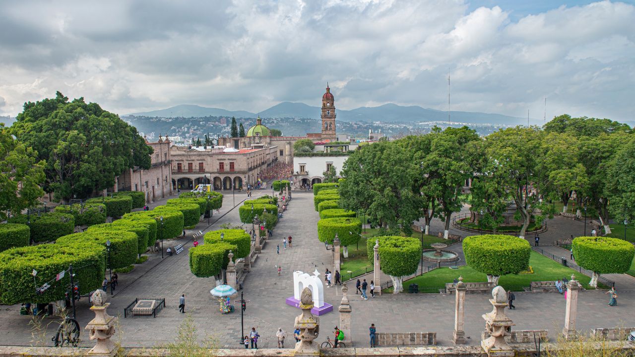 Morelia Michoacan Mexico Aug 13 2022. Aewreal view of the michoacan capitol city and its main square on a cloudy day during summer vacations.