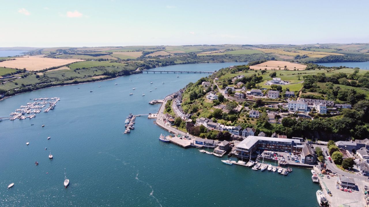 An aerial view of Kinsale town surrounded by buildings and water