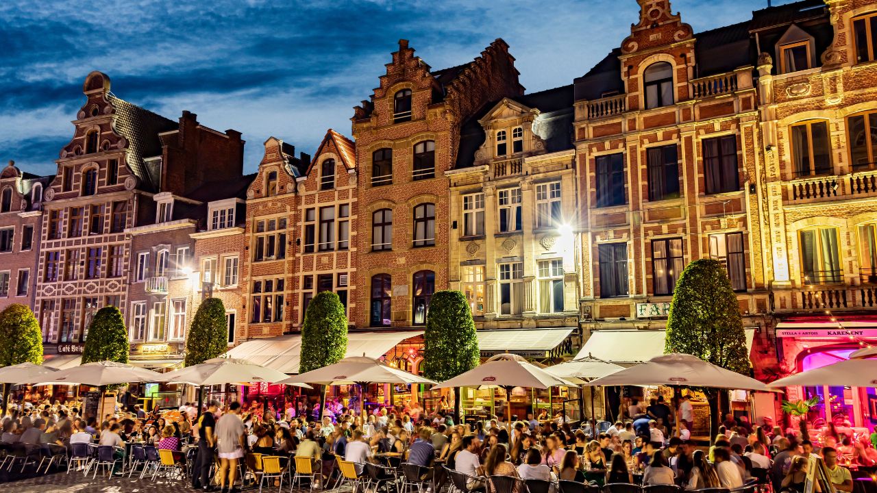 LEUVEN, BELGIUM - AUG 25, 2022: Restaurants in the old town of Leuven, in the Flemish Region of Belgium, in the night