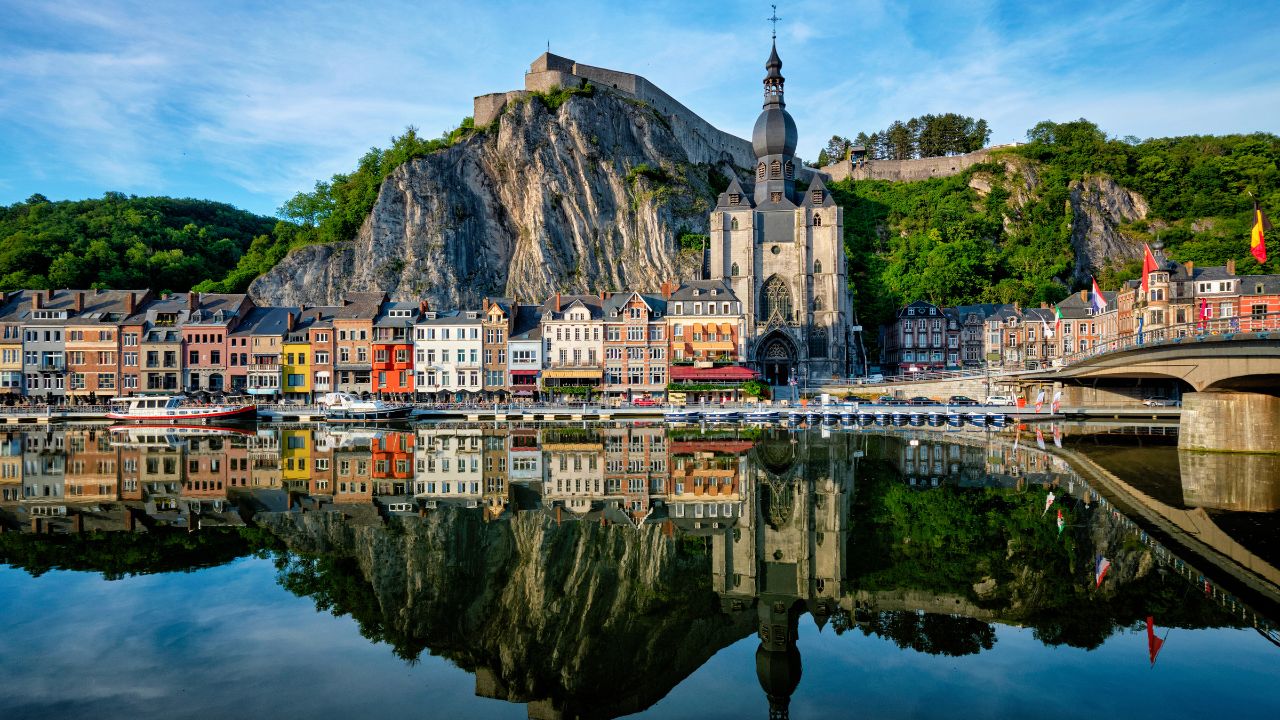 Picturesque Dinant town, Dinant Citadel and Collegiate Church of Notre Dame de Dinant and Pont Charles de Gaulle bridge over Meuse river. Belgian province of Namur, Blegium