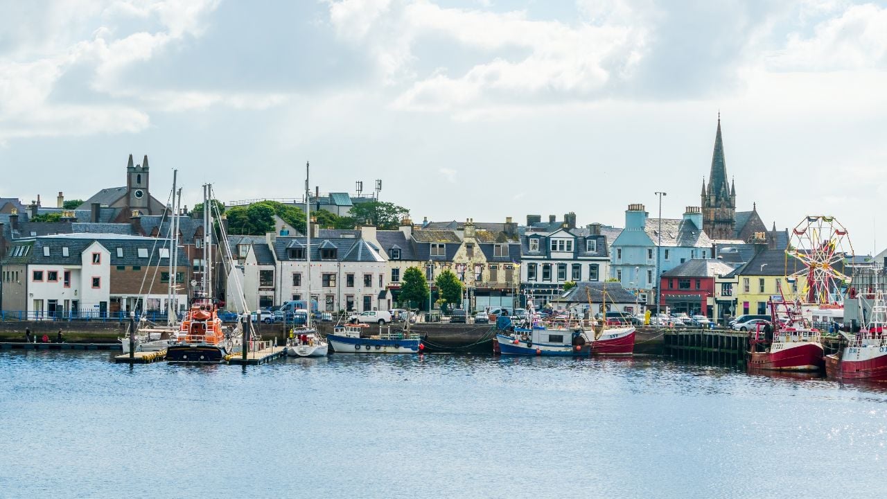 STORNOWAY, ISLE OF LEWIS, SCOTLAND, AUGUST 05, 2022: View of harbour in Stornoway, the main town of the Western Isles and the capital of Lewis and Harris in Scotland.
