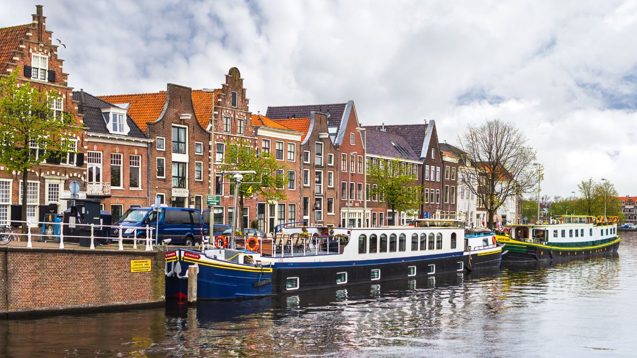 Haarlem, Netherlands - April 29, 2012: Beautiful ancient houses and the channel of Haarlem, Netherlands