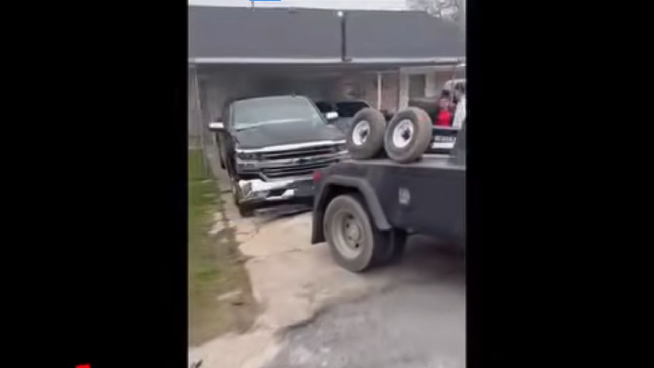 Tow truck tries to steal a car from its own driveway.